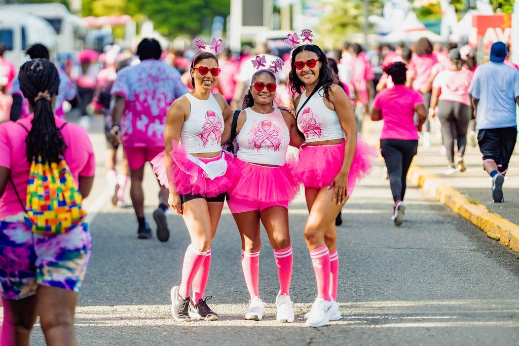 Friends Racquel Whyte, Shauna-Kay Campbell and Toni Campbell (from left) coordinate in matching pink outfits.