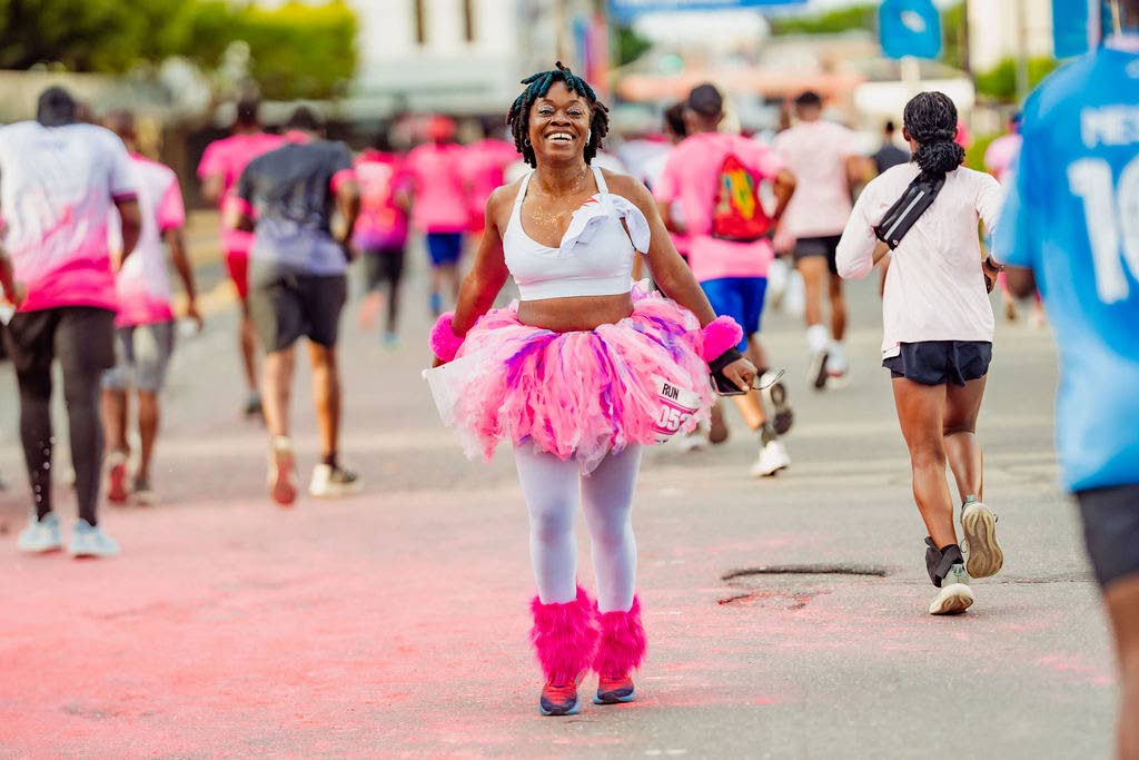 Kim Thompson of the Pacers Run Club radiates joy along the route. 