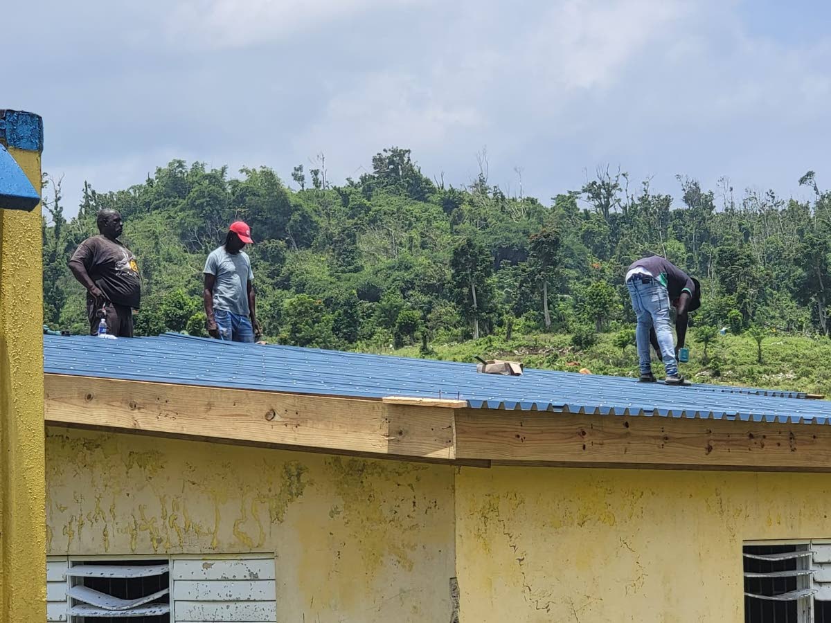 Contractors carry out reconstruction work on the agricultural science block at Maud McLeod High School.