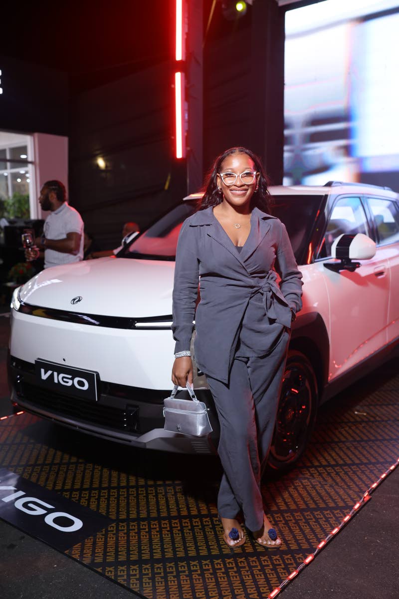Marketer Jhanielle ‘Jhandizzle’ Fuller complemented the Dongfeng VIGO in a chic grey pantsuit. 