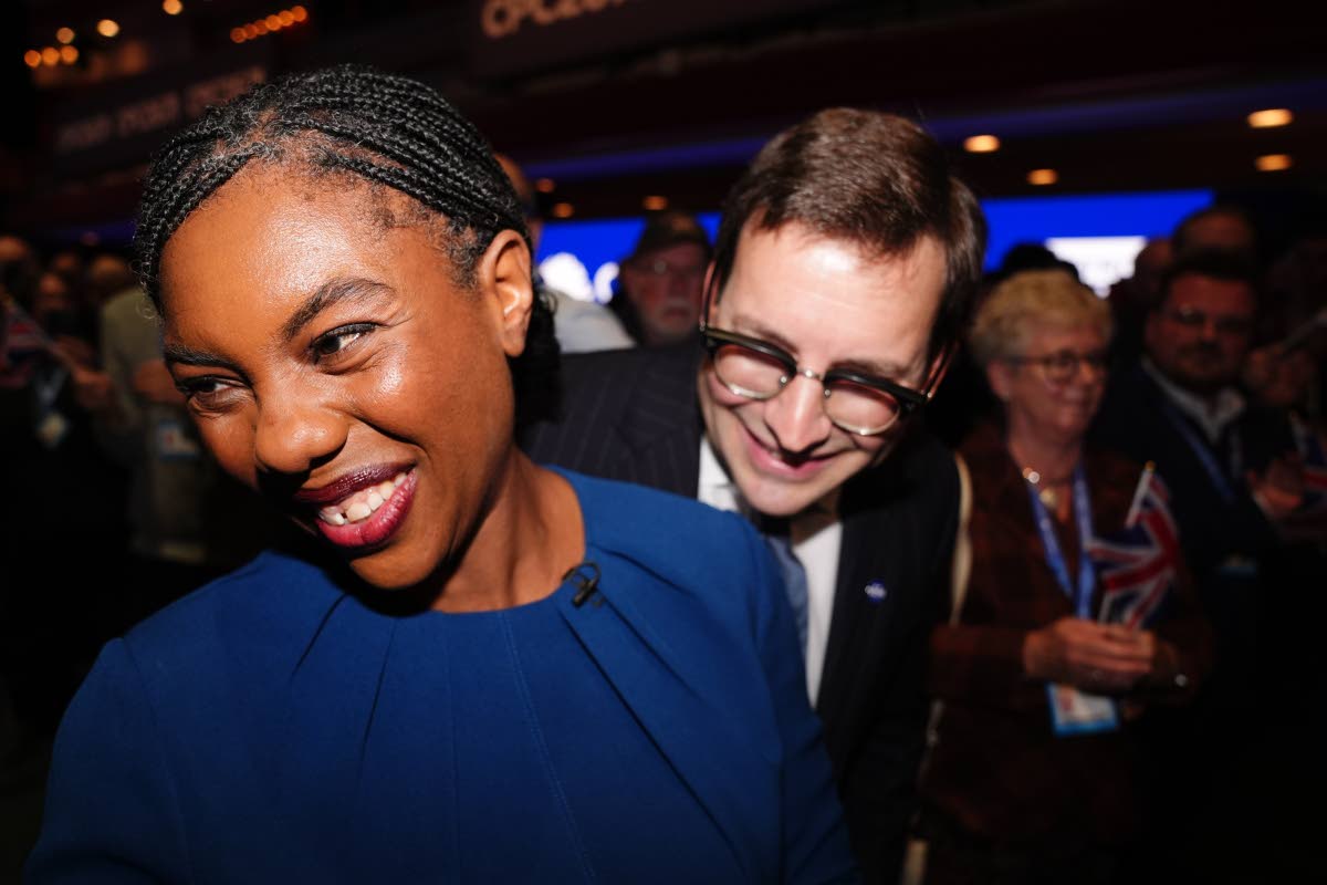 Conservative Party leader Kemi Badenoch with her husband, Hamish Badenoch, leave the stage after delivering her keynote speech during the Conservative Party conference at the International Convention Centre, Birmingham, England, Wednesday, Oct. 7, 2026.