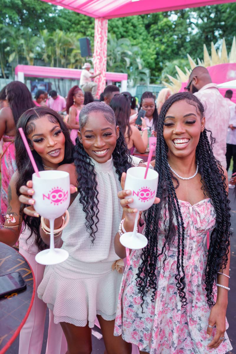From left: Adriany Carter, Karis Williams and Arianna Bernard raise a toast to good vibes.