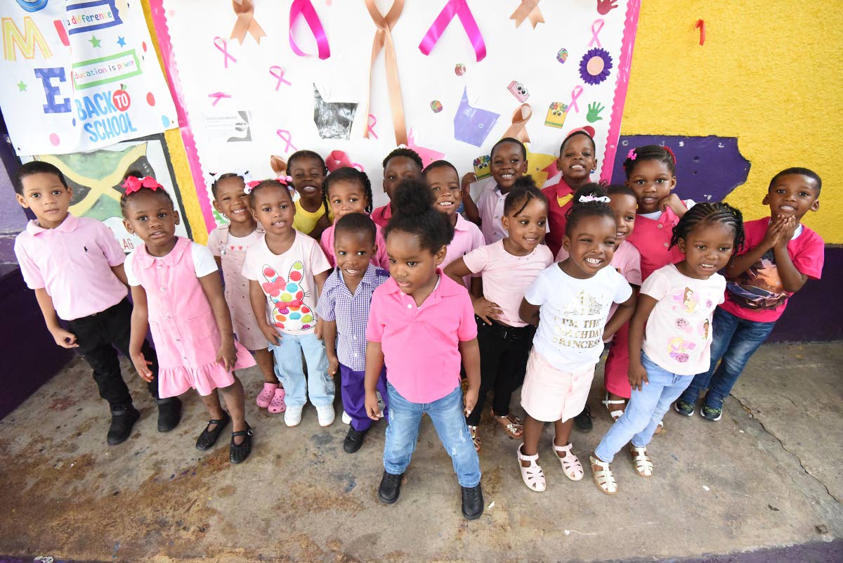 Students, teachers and parents at Gifted Minds Kindergarten, dressed in pink and gold to help raise funds to support the fight against breast cancer and childhood cancer at the Upper Elletson Road-located school on October 23. 