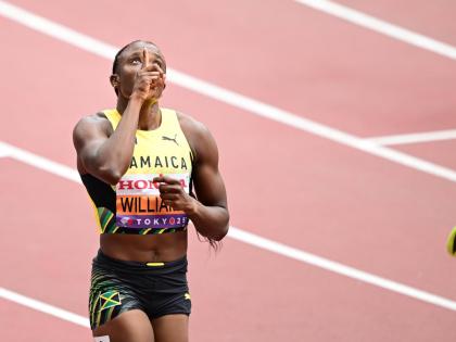 Jamaica’s Danielle Williams raises her eyes to the heavens after qualifying for the semi-finals of the 100m hurdles at the World Athletics Championships.