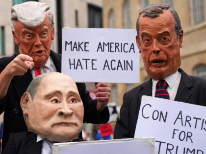 Protesters wear masks of politicians during a demonstration of the Stop Trump Coalition group against President Donald Trump's state visit in London, Wednesday, September 17, 2025.(AP Photo/Joanna Chan)