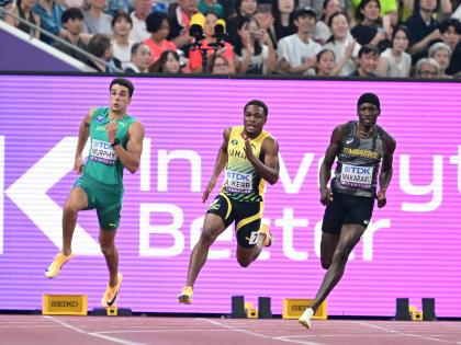 Jamaica’s Adrian Kerr (centre) competes in heat two of the men’s 200 metres qualification round at the World Athletics Championships in Tokyo, Japan, yesterday. 