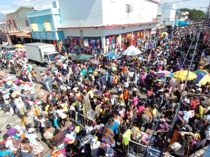 This file photo shows shoppers in downtown Kingston.