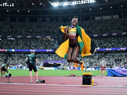 Shericka Jackson celebrates the bronze medal she won in the women's 200 metres at the World Athletics Championships inside the Japan National Stadium earlier.