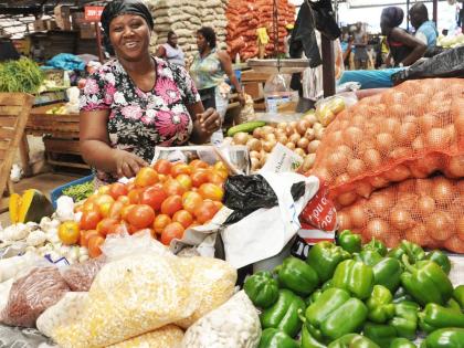 In this  photo, Joy Mc Kenzie- Johnson is seen selling vegetables at Coronation Market, downtown Kingston.