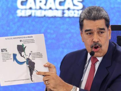 Venezuelan President Nicolás Maduro points at a map of the Americas during a press conference in Caracas.