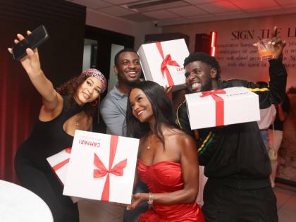 What’s an official unveiling without parting gifts? Kadejah ‘AnnaLeaX’ Anderson (left) positions her phone for a quick selfie with Rachel Silvera (centre), Jevaughn Gordon (second left) and Fabian Morris.