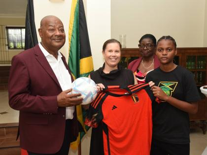 From left: Michael Ricketts, president of the Jamaica Football Federation (JFF), Her Excellency Ellen De Geest, Belgian ambassador to Jamaica, Elaine Walker-Brown, president of women’s football in the JFF, and Shauntai Pryce, young Reggae Girl, pose with