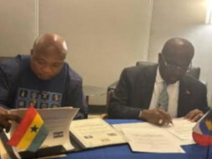 Antigua's Foreign Affairs, E.P. Chet Greene (right) and Minister of Foreign Affairs of Ghana, Samuel Ablawka, signing a visa waiver agreement.