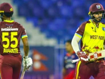 Ackeem Auguste (left) and Amir Jangoo go for a run on their way to a 10-wicket win over the West Indies at the Sharjah Cricket Stadium yesterday.