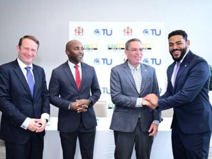 Minister of Transport, Telecommunications and Energy, Daryl Vaz, shakes hands with Caribbean Telecommunications Union (CTU) President, Senator Dominic Smith, during a CTU ICT Week 2025 press briefing on September 29. Others (from left) are Chief Executive 