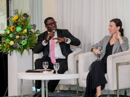 Stephen Price, vice president and general manager, Flow, speaks on Meaningful Connectivity at the Caribbean Telecommunications Union ICT Week at the Jamaica Pegasus hotel on Tuesday September 30. Looking on is Elona Cela, senior investment officer at the I