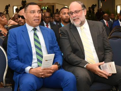 Prime Minister Dr. Andrew Holness (left) and Leader of the Parliamentary Opposition Mark Golding at the 45th Annual National Leadership Prayer Breakfast.