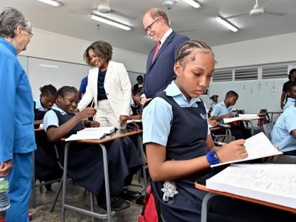Senator Dr Dana Morris Dixon (centre), minister of education, skills, youth and information; Sally Porteous (left), and David Harris (centre), president and CEO of Christel House International; speaking with the student Icana Blackwood (second left) during