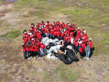 Scotia Foundation volunteers pose proudly after removing 138 bags of waste and recyclables from the coastline during their activities for International Coastal Cleanup Day.