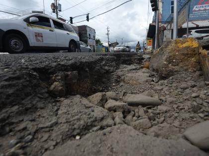 A huge pothole at the junction of Slipe Road and Studio One Boulevard in Kingston. Motorists complain that the pothole has been there for more than six months and has got wider as a result of recent rains. 