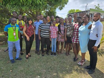  Immediate Past President of the Rotary Club of Kingston East & Port Royal Melissa Anderson (second left, front row) and Andrea Livingstone-Prince (second right), cohort chair and member of the club with trainers from TPDCo and TeenHub.