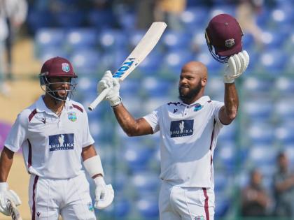 West Indies’ John Campbell (right) celebrates after scoring a century as batting partner West Indies’ Shai Hope watches on the fourth day of the second Test match against India at the Arun Jaitley Stadium in New Delhi, India on October 13. 
