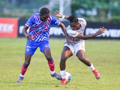 Rashaun Small (left) of Portmore United battles for the ball with Cavalier’s  Denzel McKenzie  during their Jamaica Premier League match  at the Stadium East field on October 12. Portmore won 4-2.