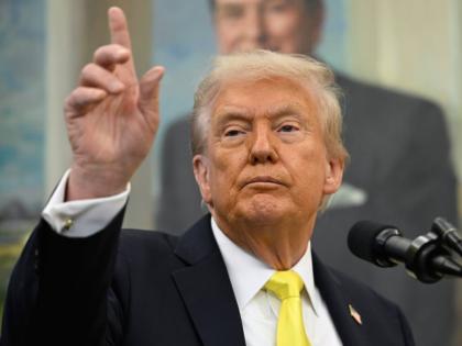 
President Donald Trump speaks during an event in the Oval Office at the White House.