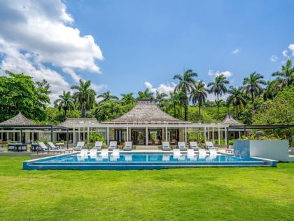A striking waterfront estate designed as a series of connected gazebo pavilions.