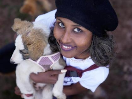 Feven Melesein, 29 years old, holds a dog that was abandoned on the streets of the capital, Addis Ababa, Ethiopia, on Sunday.