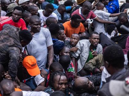 People get caught in a stampede as they attend the state funeral of former Kenya Prime Minister Raila Odinga at Nyayo National Stadium in Nairobi, Kenya, Friday, October 17, 2025. (AP Photo/Samson Otieno)