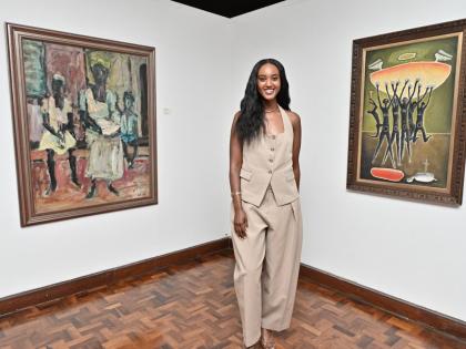 Misgana African Art founder and curator Seble Asfaw is the woman in the middle of Karl Parboosingh’s ‘Jamaican Gothic’ (1968), oil on hard board (at left) and Carl Abrahams’s ‘Hallelujah, Hallelujah, Hallelujah’ (1965), oil on hard board. 