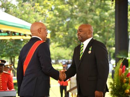 Lloyd Carney, chancellor of the University of Technology and recipient of membership in the Order of Distinction in the rank of Commander, with Governor General Sir Patrick Allen during the Ceremony of Investiture and Presentation of National Honours and A