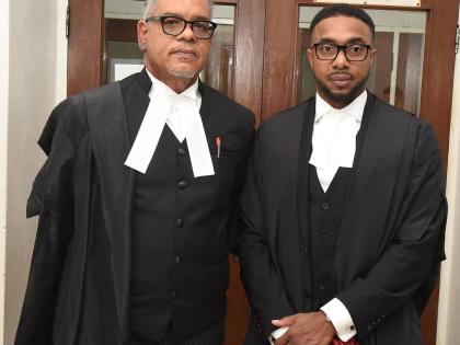 Attorneys-at-law Kevin Powell (right) and Pierre Rogers after being appointed to the Inner Bar at a ceremony at the Supreme Court on October 21.