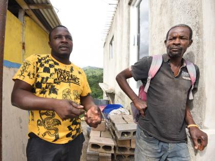 Naldy Edwards (left) and Donovan Edwards, coffee farmers in Mount Airy, St Andrew, express concerns about the fate of their unpicked coffee cherries in the field if Melissa hits the island as a tropical storm or hurricane this weekend.