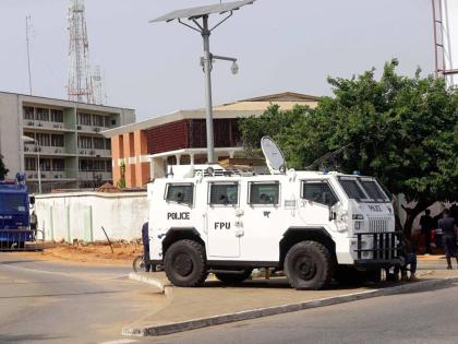 Police stand guard at the entrance of Ghana electoral commission office in Accra Ghana, December 9, 2016. 