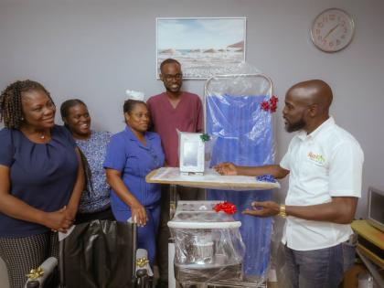 Don-Juanique Gardener (right), crash survivor, handed over medical equipment to the St Ann’s Bay Hospital on October 16. Receiving the donation are from left: Dr Tanya Hamilton-Johnson, senior medical officer at the St Ann’s Bay Hospital; Debby-Ann Hen