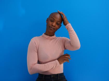 Aicha Soumaoro, a Philadelphia nurse and weekend mechanic, proudly embraces her bald look despite old-fashioned reactions from others.