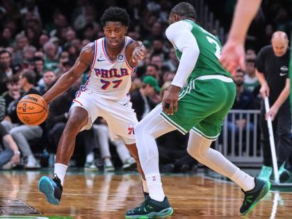 Philadelphia 76ers guard VJ Edgecombe (77) drives to the basket against Boston Celtics guard Jaylen Brown (7) during the second half of an NBA basketball game, Wednesday, October 22, 2025, in Boston. 