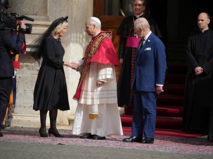 Pope Leo XIV, centre, with Queen Camilla and King Charles III in the St. Damasus Courtyard at the Vatican after a state visit and pray with him in the Sistine Chapel.