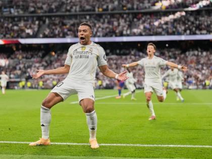 Real Madrid’s Kylian Mbappe reacts after scoring during a La Liga match between Real Madrid and Barcelona in Madrid, Spain, yesterday.