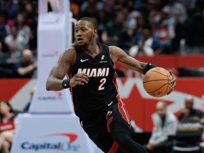 Miami Heat guard Terry Rozier brings the ball up court during the second half of an NBA basketball game against the Washington Wizards in Washington, Monday, March 31, 2025.