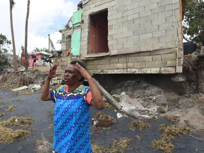 Betty-Lyn Brown, a 60-year-old resident of Compound in Alligator Pond, Manchester, explains how a section of her house got washed awayed during the passage of Hurricane Melissa on Tuesday.
