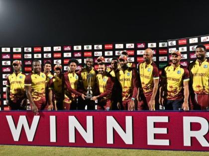 The West Indies pose with the winners’ trophy after whitewashing Bangladesh in their T20I series. 