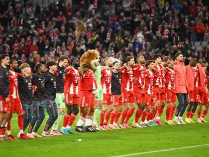 Bayern Munich players celebrate their victory after the Bundesliga match between Bayern Munich and Borussia Dortmund in Munich, Germany, Saturday, October 18, 2025. 