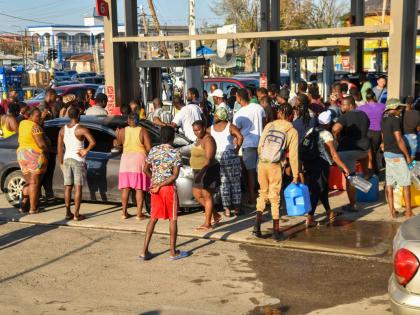 Residents scramble to get gasolene for their vehicles, generators and the like at Total gas station, Savanna-la-Mar, Westmoreland, on October 31. 