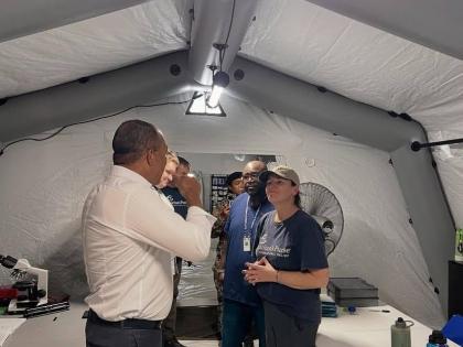 Minister of Health and Wellness, Dr Christopher Tufton, (left) with a team from international Christian relief organisation Samaritan’s Purse at the field hospital that was set-up by the organisation on the grounds of the Black River High School in St El