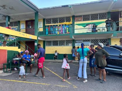 Persons at the hurricane shelter at the Petersfield High School in Westmoreland.
