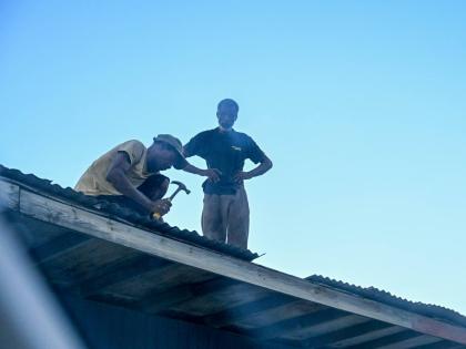 Portlanders making home repairs on November 4, following the passage of Hurricane Melissa on October 28. 