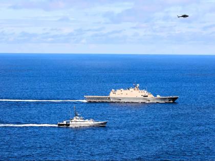  USS Wichita and HMJS Cornwall sail in formation during a live-fire exercise on April 9, 2021.